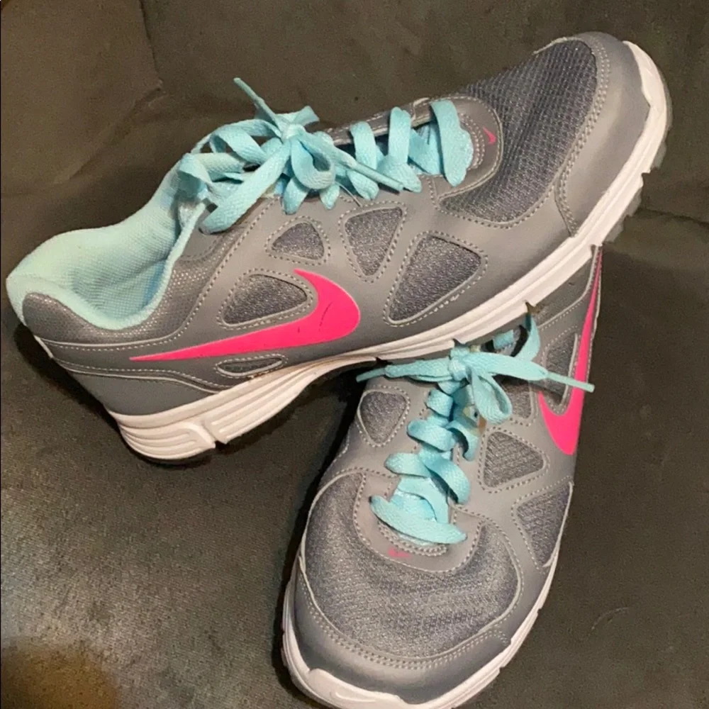 Nike Women’s Gray Athletic Shoes with Pink Swoosh and Light Blue Accents
